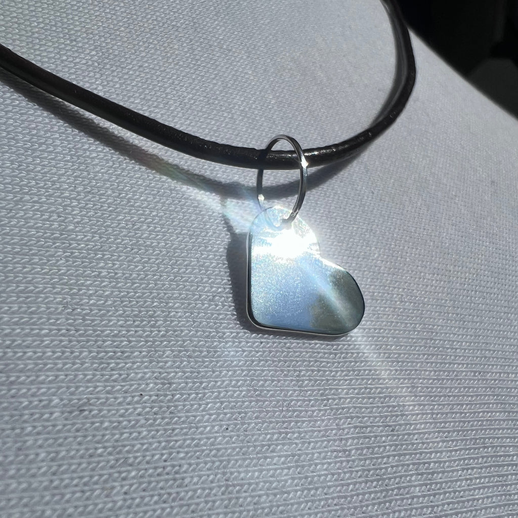 Heart-shaped pendant with leather cord