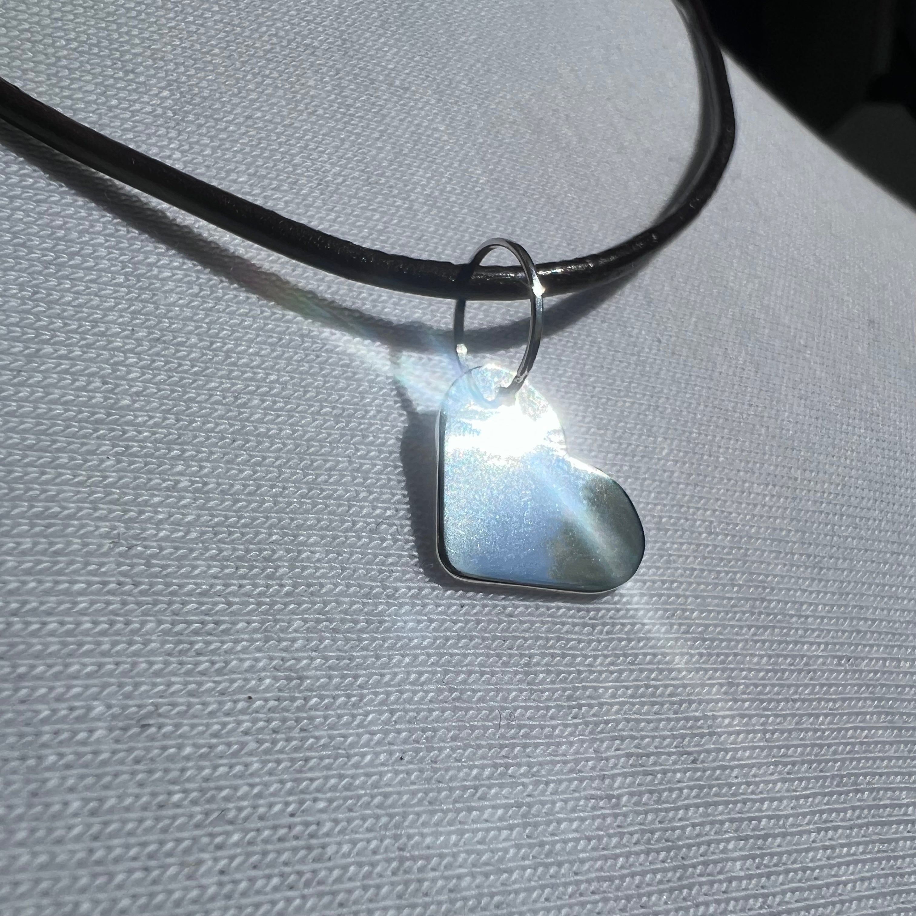 Heart-shaped pendant with leather cord